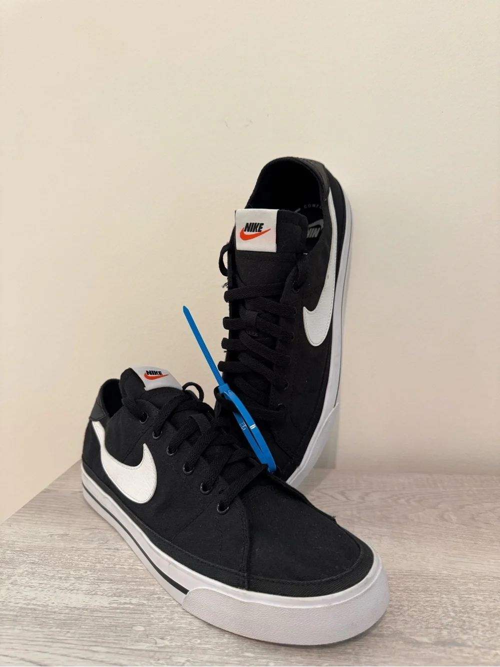 Nike Men’s Black & White Low-Top Sneakers with Orange Logo